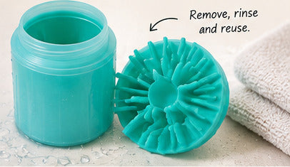 MuddyMate cup with its removable bristle insert beside a towel